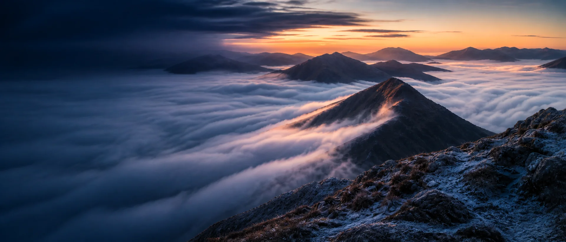 Highland peaks emerging through a cloud inversion at dawn